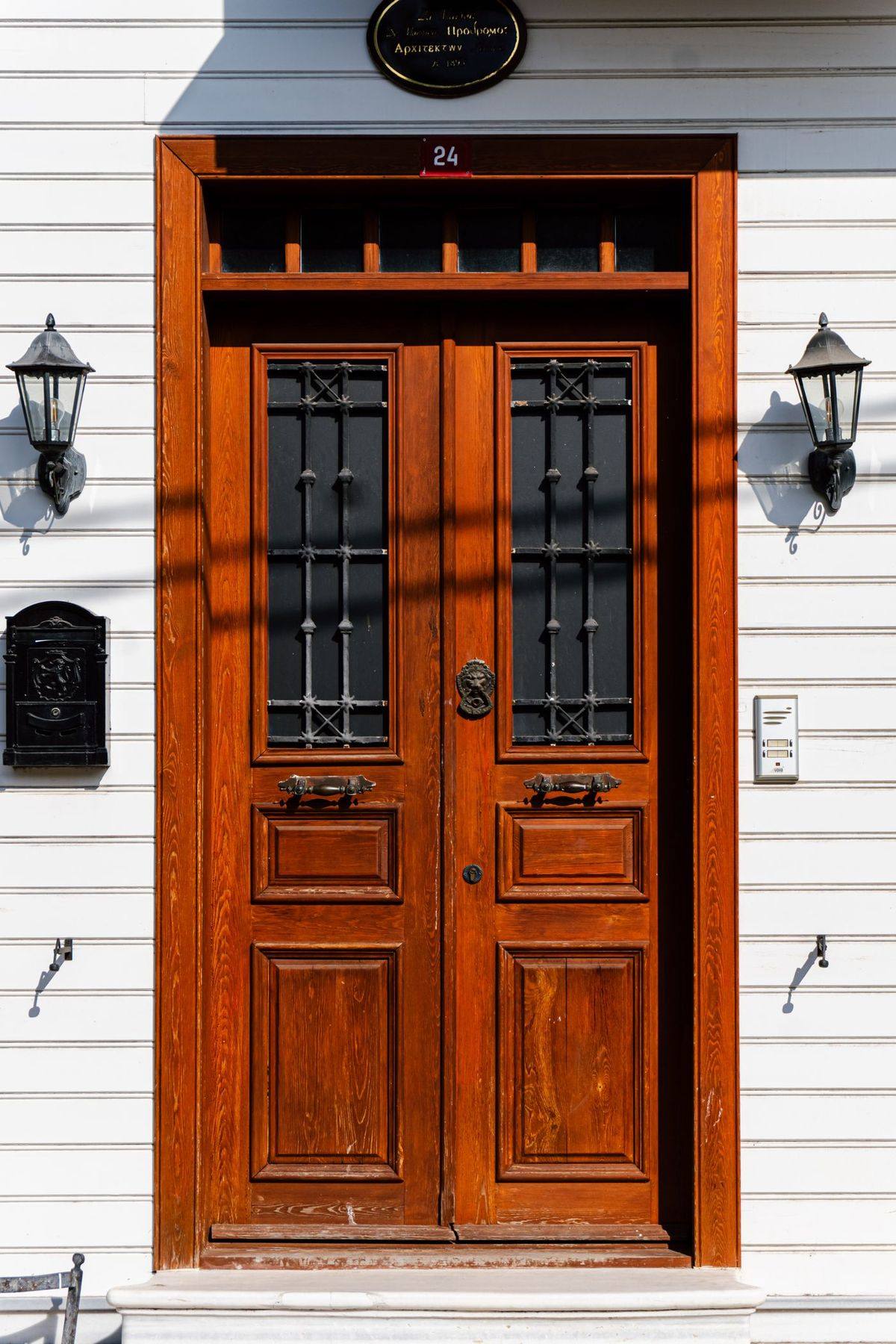A reinforced wooden front door after repair work